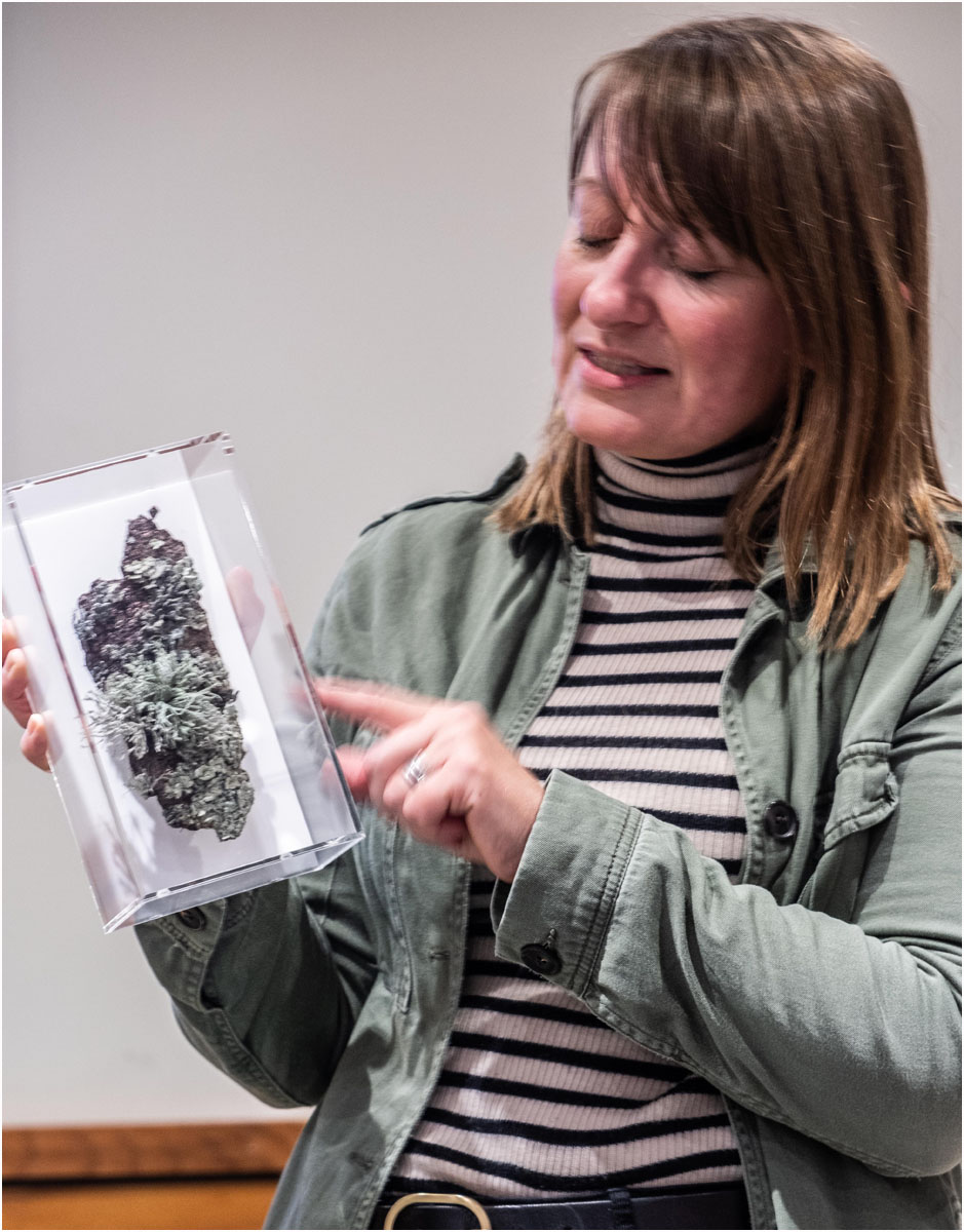 Amanda demonstrating one of her framed pieces