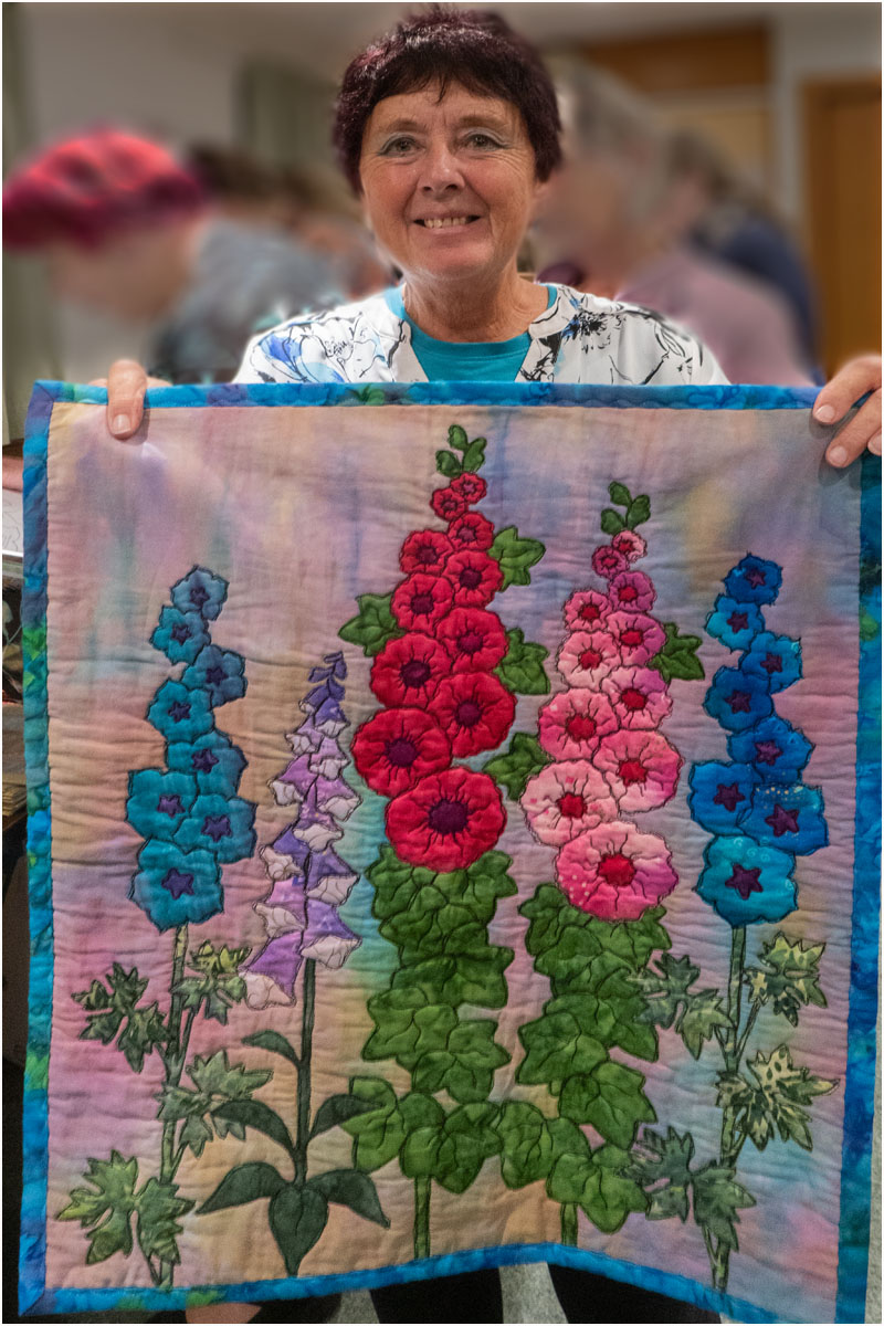 Gail Lawther with flower quilt