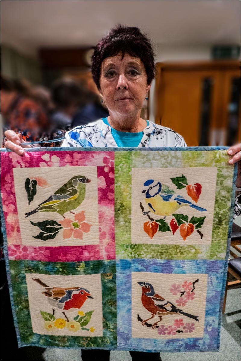 Gail Lawther with her bird quilt