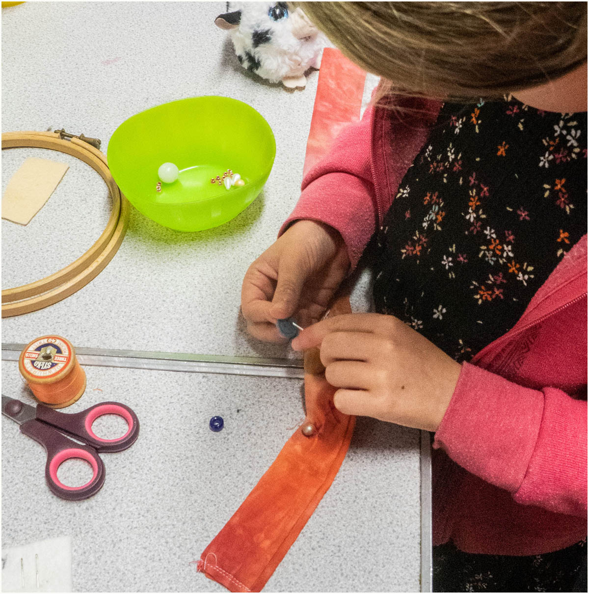 Sewing on decorative buttons